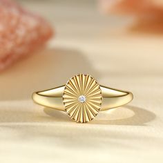 Classic with a modern twist, this beautiful oval signet ring from Jeulia is a perfect addition that adds instant sophistication to every outfit. Plated with gleaming yellow gold tone sterling silver, the white stone at the centre creates a sparkle from all angles, enhancing the elegant style.Carat Weight: 0.029 ctStone Size: 1.5 mmStone Type: Jeulia® StoneNumber of Stones: 1 Stone Shape: RoundStone Color: Diamond WhiteWeight: 3.1 gWidth: 2.1 mmHeight: 3.6 mmThickness: 1.1 mmMaterial: 925 SilverP Gold Oval Cabochon Diamond Ring, Luxury Gold Oval Dome Ring, Luxury Gold Dome Ring, Elegant Diamond Signet Ring Tarnish Resistant, Modern Gold Signet Ring With Oval Cabochon, Modern Gold Oval Cabochon Signet Ring, Modern Gold Oval Cabochon Dome Ring, Classic Gold Plated Oval Rings, Modern Gold Dome Ring With Oval Cabochon