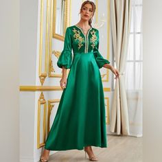 Gorgeous Oblique Green Dress. It Has A Notch Neckline, Quarter Length Bishop Sleeves, Long Length, Non Stretch, And Made Of 100% Polyester. This Item Ships Immediately Worldwide! Elegant Embroidered Green Maxi Dress, Elegant Green Embroidered Long Sleeve Dress, Elegant Long Sleeve Green Embroidered Dress, Green Floral Embroidered Dress For Eid, Green Floral Embroidery Dress For Eid, Green Embroidered V-neck Maxi Dress, Green V-neck Dress For Festive Occasions, Green V-neck Dress For Festive Season, Festive Green V-neck Dress