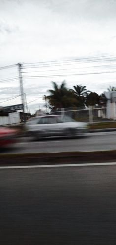 a blurry photo of cars driving down the road