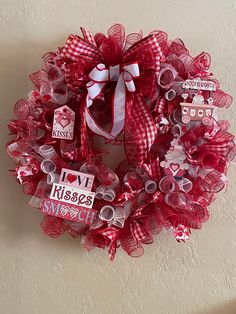 a valentine's day wreath hanging on the wall