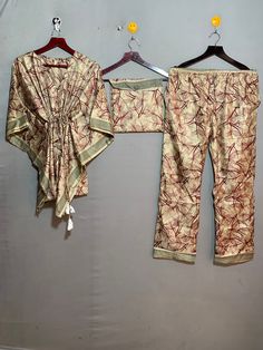 "kgncraft presenting this set of Indian Art Silk sari pajamas made up of a short kaftan, which is decorated with handmade stitches, and loose-fitting pants with an elastic waist, button detail. it can be worn at home and out. Art Silk fabric , floral printed night suit, it is done differently. it's not just nightwear, ideal for staying at home, sleeping, but also for lounge time and even parties. Short kftan and loose fit trousers / pants . with the holiday season just around the corner, it's th Budget Bridesmaid Dresses, Silk Pj Set, Bridesmaid Pajama, Loose Fit Trousers, Bridesmaid Pajama Set, Floral Pajama Set, Short Kaftan, Loose Fitting Pants, Bridesmaid Pyjamas