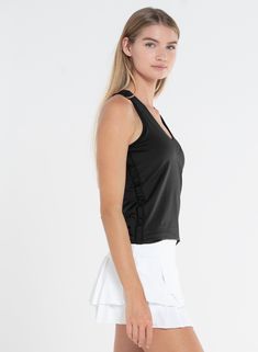 The classic tennis tank redefined! This black V-neck tank with a built-in bra has a racerback and side mesh inserts for maximum breathability. Sporty Tennis Activewear With Built-in Bra, Black Sleeveless Tennis Dress With Built-in Bra, Black Tennis Dress With Built-in Bra, Black Sleeveless Tennis Dress For Gym, Black Tennis Dress For Gym, Functional Black Tank Top With Tank Straps, Sporty V-neck Tank Top With Built-in Bra, Sporty Sleeveless Black Tennis Dress, Fitted Tank Top For Tennis