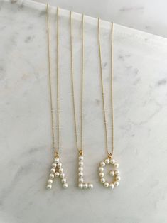 Your choice of 14k gold-filled ball chain or a freshwater pearl necklace Please specify your letter(s) in the notes section at checkout! Pearl Letters, Freshwater Pearl Necklace, Freshwater Pearl Necklaces, Letter Necklace, Letter S, Ball Chain, Jewelry Care, Freshwater Pearls, Gold Filled