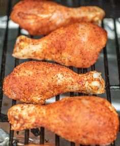 chicken wings cooking on the grill in an oven