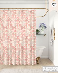 a bathroom with a pink shower curtain next to a bath tub