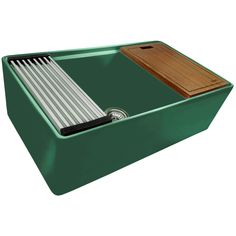 a green tray with two wooden chopsticks and a cutting board in the bottom