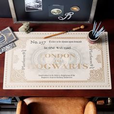 there is a certificate on the table with scissors and other items around it that are sitting on top of a chair