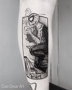 a spiderman tattoo on the arm