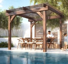 a man and woman sitting at a table under a pergolated gazebo next to a pool