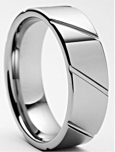 a wedding ring with an unusual design on the outside and inside, is shown in white gold