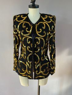 Vintage handmade sequined evening jacket by Stenay. Made in India. 100% silk. Size S. Excellent condition. There are hidden hooks all the way down the front to wear it closed. Winter Silk Blazer For Party, Winter Party Silk Blazer, Elegant Gold Outerwear With Sequins, Gold Sequin Blazer For Evening, Festive Sequined Evening Outerwear, Festive Evening Outerwear With Sequins, Festive Silk Party Blazer, Fitted Silk Outerwear For Party, Silk Fitted Party Outerwear