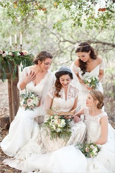 the bride and her bridesmaids are all dressed in white