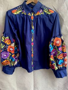 Vintage Blue Floral Embroidery Top Shirt Blouse Embroidered Flowers Balloon Sleeves Colorful Ethnic Ukrainian Design by Richarme on Etsy Bohemian Cotton Blouse With Embroidered Cuffs, Traditional Cotton Blouse With Embroidered Cuffs, Festive Long Sleeve Blouse With Embroidered Cuffs, Traditional Long Sleeve Blouse With Embroidered Cuffs, Bohemian Blue Embroidered Top With Geometric Patterns, Blue Long Sleeve Top With Resham Embroidery, Traditional Long Sleeve Top With Embroidered Cuffs, Bohemian Blue Blouse With Geometric Embroidery, Traditional Long Sleeve Embroidered Top With Embroidered Cuffs