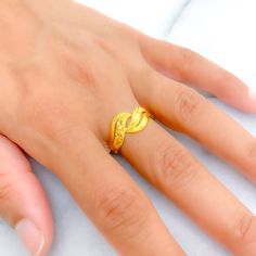 This 22k gold ring features a chic radiant design, perfect for adding elegance to any outfit. Weighing 3.0 grams, it showcases a yellow gold finish that enhances its sophisticated and stylish appearance. Sized at 8, with resizing available, this ring combines style and practicality, making it ideal for daily wear or special occasions. Suitable for those who appreciate refined and fashionable jewelry, this ring brings a touch of luxury and radiant charm to your collection. PRODUCT DETAILS Gold Purity(karat): 22k Gold Weight(grams): 3.0 Item Finish: Yellow Gold Ring Size: 8 Ring Sizing Available: Yes