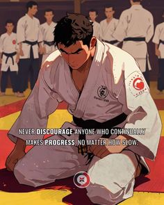 a man sitting on the ground in front of a group of men wearing karate uniforms