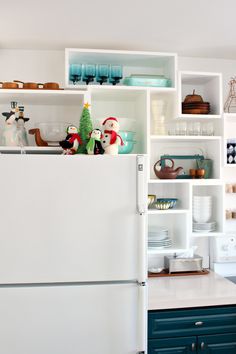 a white refrigerator freezer sitting inside of a kitchen