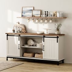 a white cabinet with open shelves and baskets on the top, next to a rug