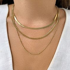 This Adornia 14k gold plated layered chain necklace makes for a bold fashion choice. This Adornia 14k gold plated layered chain necklace makes for a bold fashion choice. Nickel free Metal: stainless steel Chain length: 18 in. + 2-in. extender Packaging: pouch Plating: 14k gold Finish: polished Chain type: cable, curb, snake Size: 17". Color: Yellow. Gender: female. Age Group: adult. Tarnish Resistant Gold Layered Necklace, Gold Tarnish-resistant Layered Necklace, Gold Snake Chain Layered Necklace Gift, Gold Snake Chain Layered Necklace For Gift, Gold Plated Layered Snake Chain Necklace, Gold Plated Clavicle Style Herringbone Necklace, Gold Chain Necklace For Layering, Tarnish Resistant, Gold-plated Herringbone Necklace With Clavicle Chain, Gold Plated Snake Chain Layered Necklace