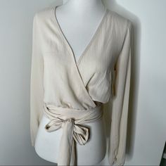 Size Xs Fashion Nova Cream To! Classy! Dress Up Or Down. Brand New Condition. Neutral V-neck Top For Day Out, Casual Beige Wrap Top, Chic Beige Wrap Top, Beige Wrap Top For Day Out, Spring V-neck Wrap Top In Solid Color, Beige Fitted Wrap Top, Fitted Wrap Beige Top, Fitted Beige Wrap Top, Beige Wrap Top For Spring