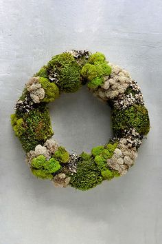 a moss wreath with the words mixed moss hand crafted forest wreath