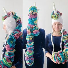 two women wearing crocheted unicorn hats and scarves, one in multicolored yarn