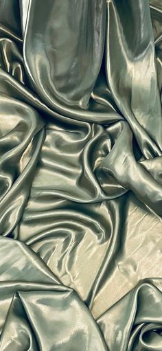 Our shimmer satin has a superior drape like no other. This luxurious fabric has a soft touch and glows beautifully creating a perfect blend between the shimmer and satin. Perfect for all types of dressmaking, crafting, decorating and various other projects.  *Colours may vary due to different screens.  *Width 58 inches *Synthetic *Machine Washable *If you order more than 1 meter, fabric will come as one continuous length. *Fast Delivery Before you go please check out our other items. We offer co Sage Green Fabric, Dark Sage Green, Costume Making, Bed Scarf, Dusty Green, Gold Shimmer, Green Satin, Green Silk, Table Tops