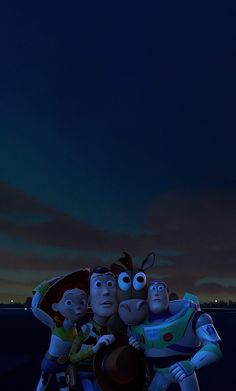 three cartoon characters standing in front of a night sky