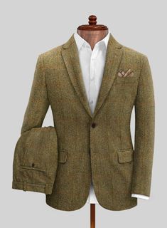 Make a debonair style statement in the Harris Tweed Country Brown Check suit. Crafted from pure wool, the check fabric brings an extra dose of interest, giving a unique flair to the classic style. Pair it with a matching waistcoat, a white shirt and brown derby shoes. 
 
 Look Includes  Harris Tweed Country Brown Check Fabric  Two Button Jacket Style  Notch Lapel  Real Horn Brown Buttons  Single Vent  Three Cuff Buttons  Two Welted Back Pockets on Trousers   You can change the look during custom Grey Tweed Suit, Herringbone Tweed Jacket, White Linen Suit, Green Velvet Jacket, Peaky Blinders Suit, Harris Tweed Jacket, Brown Derby, Royal Blue Suit, Italian Shirts