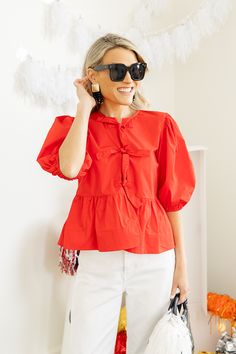 We'll be looking for every excuse to wear this trendy, cute top. The relaxed peplum silhouette features 3 bow ties down the open front. Puff sleeves complete the look. Gameday Outfit, Cute Tops, Boutique Clothing, Peplum Top, Puff Sleeve, Cute Dresses, Red, Dresses, How To Wear