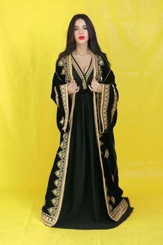 Moroccan Velvet Caftan - 2-Piece Set (One Size Fits Most, Up to XL) Discover the elegance of Moroccan craftsmanship with this luxurious velvet caftan set, beautifully tailored to fit sizes up to XL. Made from high-quality velvet, this 2-piece kaftan features intricate "Skalie" embroidery and exquisite "Sfifa" detailing, all handcrafted by master artisans ("Maalam"). The perfect blend of tradition and sophistication, this outfit is ideal for special occasions or elegant evenings. Customizable to Bohemian Abaya With Traditional Drape, Eid Floor-length Kaftan With Chikankari Embroidery, Eid Chikankari Embroidery Floor-length Kaftan, Bohemian Floor-length Kaftan For Traditional Ceremonies, Bohemian Kaftan With Embroidered Border, Bohemian Kaftan With Embroidered Border And Traditional Drape, Bohemian Kaftan With Gold Embroidery For Festive Occasions, Long Kaftan With Gold Embroidery For Festivals, Festive Bohemian Kaftan With Gold Embroidery