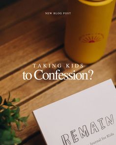 a note sitting on top of a wooden table next to a yellow cup and plant