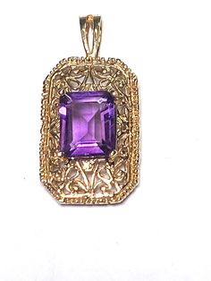 A layaway plan is available for this pendant. This is a 10K ladies prong set Amethyst pendant made from solid 10K yellow gold. The pendant measures 1 1/8 of an inch high and 5/8 of an inch wide. The amethyst stone measures 7mm wide X 10mm tall. The stone is prong set and the setting is in good condition. The pendant weighs 4.5 grams. Classic Purple Pendant Jewelry, Bezel Pendant, Yellow Gold Pendants, Amethyst Pendant, February Birth Stone, Amethyst Stone, Gold Pendant Necklace, Purple Amethyst, Solid Yellow