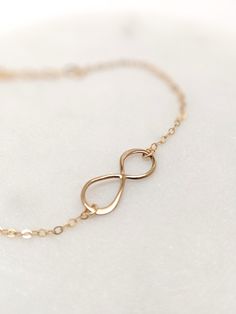 "Our gift to you 10% off your first purchase. Details here - http:/eepurl.com/dpVPBz A meaningful charm bracelet. The dainty infinity symbol is suspended from our signature dainty but strong chain. Ideal for everyday wear and makes a thoughtful gift for that someone special. DETAILS 14 k fill or Sterling Silver Infinity charm measures 3/4\" Beautiful and dainty chain Comes with a 1\" extender chain to fine tune your fit This listing is for one infinity bracelet only FIND THE PERFECT FIT - MEASUR Elegant Infinity Jewelry For Friendship, Minimalist Infinity Jewelry For Friendship, Adjustable Infinity Friendship Jewelry, Elegant Rose Gold Bracelets As Best Friend Gift, Elegant Rose Gold Bracelet For Best Friend Gift, Hypoallergenic Rose Gold Infinity Jewelry, Elegant Infinity Bracelets For Mother's Day, Elegant Infinity Bracelet For Mother's Day, Minimalist Infinity Bracelet As A Gift