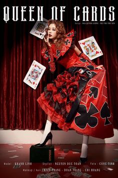 a woman in a red dress is holding cards and posing for the cover of queen of cards