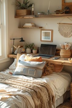 a laptop computer sitting on top of a wooden desk next to a bed in a bedroom