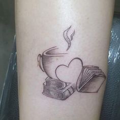 a tattoo with books and a heart on it