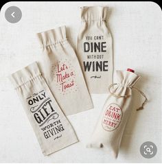 three wine bags with the words, you can't dine without wine