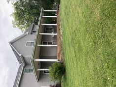 a house that is sitting in the grass