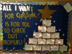 a christmas tree made out of cards with lights on it and words all i want for christmas is for you to check out properly