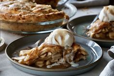 there is a pie on the table with ice cream on it and another pie in the background