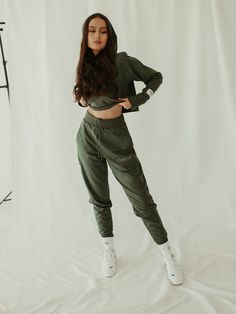 Making sweatpants cool. The classic Jogger just got a major update in a sage green. These jogger sweatpants are designed to take you from your Zoom call to a night out. This relaxed silhouette has a high waist rib-knit waistband and cuffs for a super stretchy fit and features a hidden adjustable drawstring at the waist,  pockets and embroidery detailing. Made from our premium mid-weight cotton, these sage green joggers will make you feel damn good.   10% of proceeds benefit female forward charit Sporty Cargo Pants With Ribbed Cuffs For Streetwear, Sporty Green Cargo Pants For Streetwear, Green Joggers With Elastic Waistband For Streetwear, Green Relaxed Fit Joggers For Fall, Sporty Spring Joggers For Elevated Casual Wear, Sporty Khaki Sweatpants With Pockets, Green Athleisure Cargo Pants For Sports, Khaki Sweatpants With Pockets For Loungewear, Sporty Khaki Joggers With Pockets