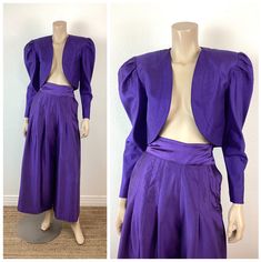 Vintage 1980s Purple Silk Suit jacket has padded shoulders cropped length cutaway front pants are high waisted pleated buttons at side hip pockets wide legs cropped length purple in color silk material great vintage condition appx size - XS / S jacket - 18 pit-pit 15 length skirt - 23 waist 38 hip 41 length All sales are final Wide Leg Palazzo Pants, Silk Suit, Purple Silk, Silk Material, Suit Set, Wide Legs, Palazzo Pants, Crop Jacket, Suits For Women