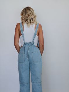 The "All American" overalls feature a straight neckline, front metal buttons, front side pockets, thick straps around the lower back, and ankle-length wide legs. True to size, little to no stretch Krista is wearing a Medium Krista's measurements: Waist- 27" Hips- 38" Height- 5'10" Bust- 34" (Typically a Medium) 100% COTTON Travel Must Haves, Bachelorette Trip, Straight Neckline, All American, European Summer, Wide Legs, Guinea Bissau, British Indian, Mozambique