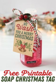 a bottle of soap with a christmas tag hanging from it's side and the words, we wash you a merry christmas