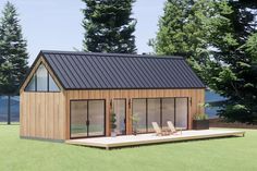 a small wooden house sitting on top of a grass covered field next to some trees