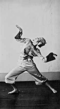 an old photo of a man dancing