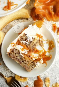 a piece of cake sitting on top of a white plate next to a banana peel