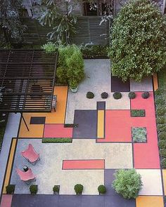 an aerial view of a patio with seating and trees