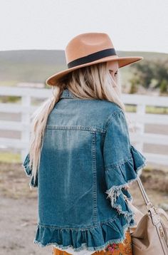 Our Scottie Ruffle Denim Jacket perfectly blends the classic style we love in a jean jacket with updates like a cropped hemline and short sleeves trimmed with a frayed denim flounce. This medium wash has flap-pockets and silvery stud-buttons with a modern, boxy cut that is just right for so many beautiful seasons. *Due to lighting and differences in monitors, actual colors may vary slightly from what appears online. Model is 5'8" and wearing a size small. Approximate measurements: S/M: Bust: 43 Short Sleeve Denim Jacket, Trendy Denim Jacket, Ruffled Denim Jacket, Short Sleeve Denim, Trendy Denim, Short Sleeve Jacket, Blue Jean Jacket, Ruffle Shorts, Ruffled Sleeves