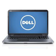 an open laptop computer sitting on top of a white surface with the dell logo above it